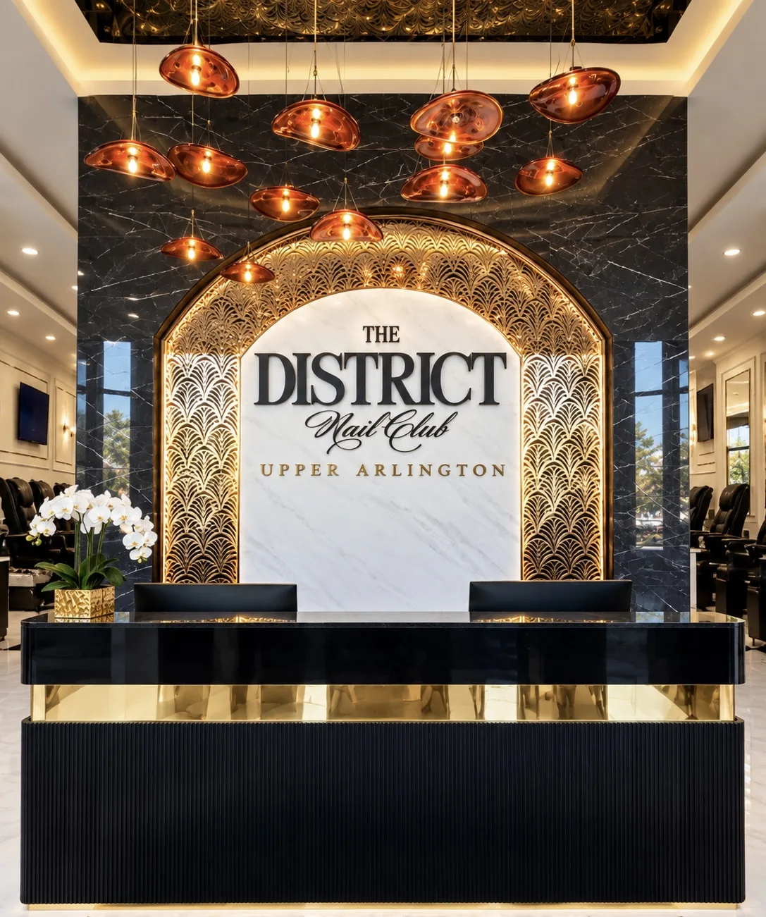 District Nail Club reception with marble logo wall