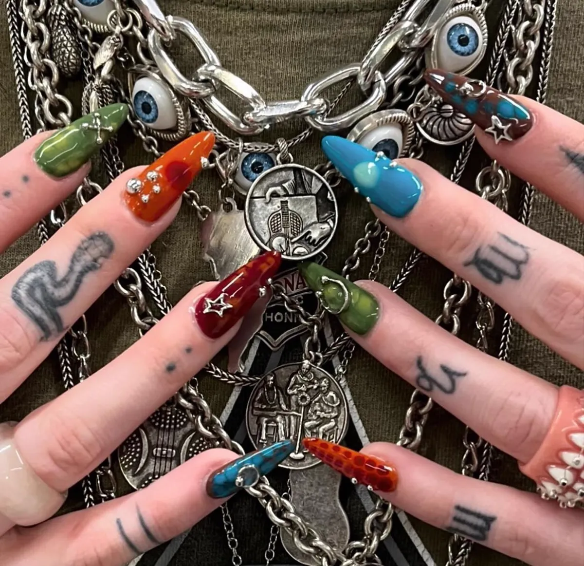 Long nails with mixed charms, crystals and multicolored custom art