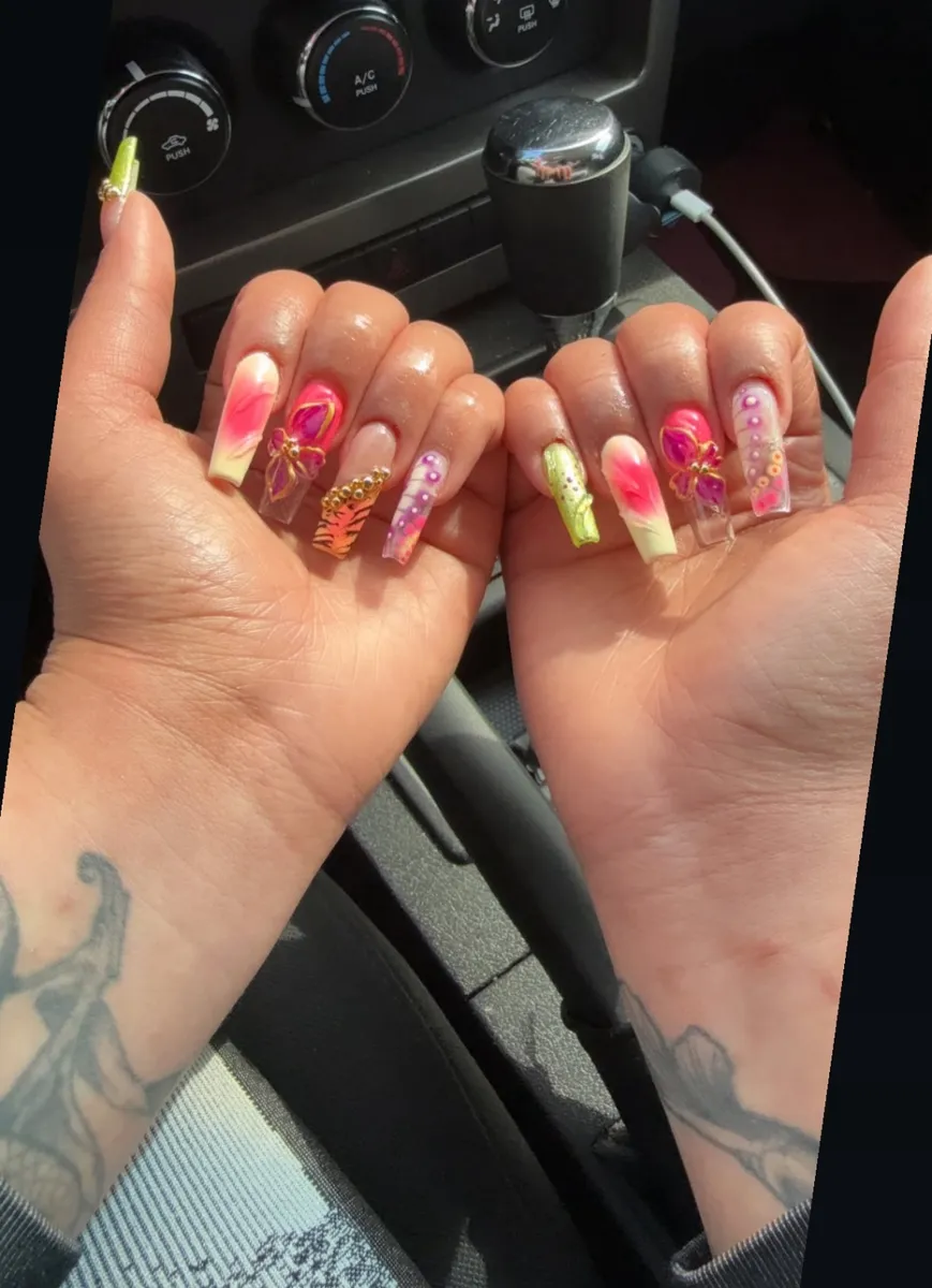 Long square nails with pink and orange airbrushed floral art
