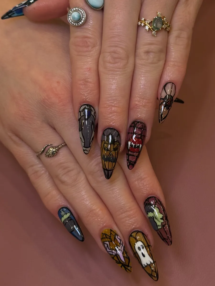 Long almond nails with hand-painted Halloween art, ghosts and haunted houses